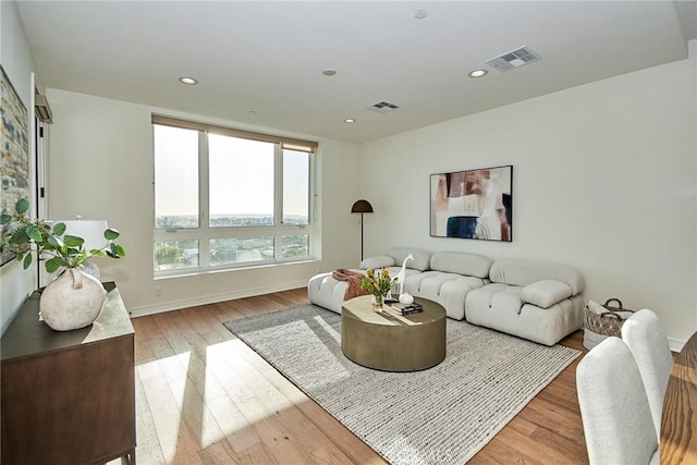 1050 N Joels Pl, Los Angeles, CA 90012 - living room with light wood-style flooring and recessed lighting