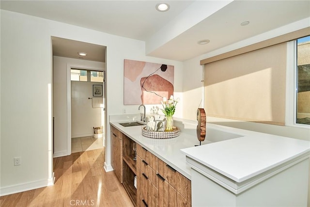1050 N Joels Pl, Los Angeles, CA 90012 - bathroom featuring wood finished floors, double vanity, and recessed lighting