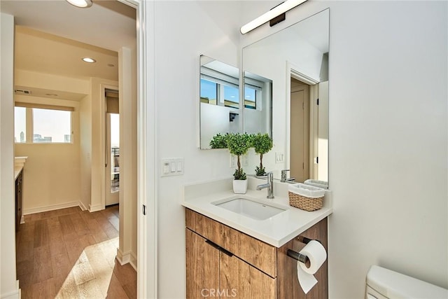 1050 N Joels Pl, Los Angeles, CA 90012 - bathroom with vanity, recessed lighting, wood finished floors, and plenty of natural light