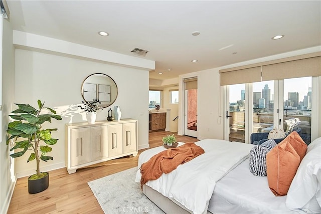 1050 N Joels Pl, Los Angeles, CA 90012 - bedroom with access to exterior, light wood-type flooring, recessed lighting, and a view of skyline