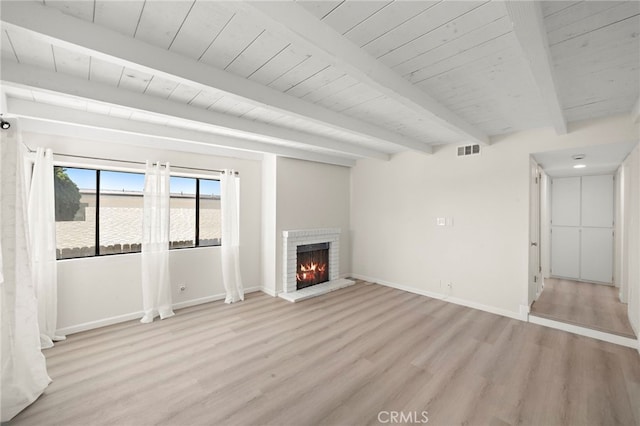 33771 Copper Lantern St, Dana Point, CA 92629 - unfurnished living room featuring light wood-style floors, a wood ceiling with exposed beams, and a brick fireplace