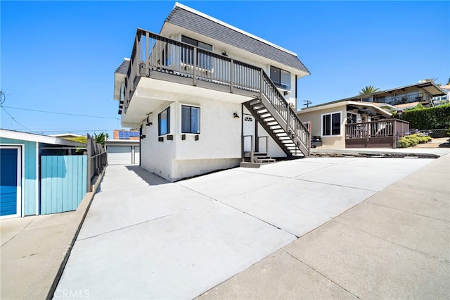 33771 Copper Lantern St, Dana Point, CA 92629 - view of front of house featuring stairs, stucco siding, and an outbuilding