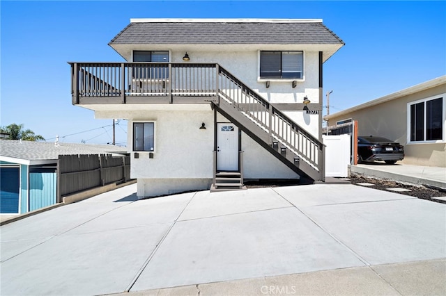33771 Copper Lantern St, Dana Point, CA 92629 - rear view of house with a shingled roof, stucco siding, mansard roof, and stairway
