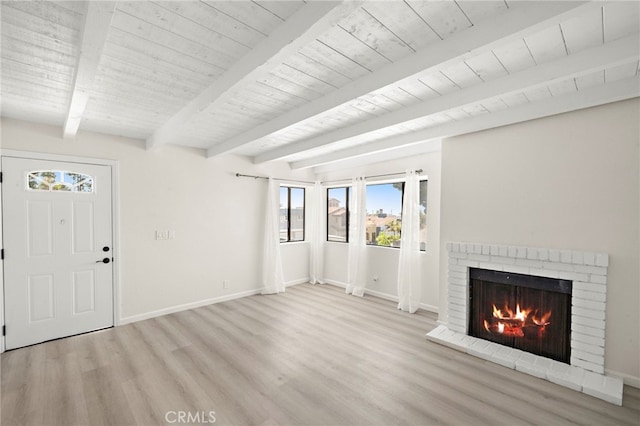 33771 Copper Lantern St, Dana Point, CA 92629 - unfurnished living room featuring wood finished floors, a brick fireplace, and a wood ceiling with exposed beams