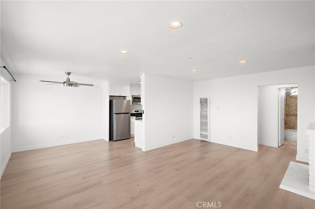 33771 Copper Lantern St, Dana Point, CA 92629 - unfurnished living room featuring a heating unit, a ceiling fan, recessed lighting, and light wood finished floors