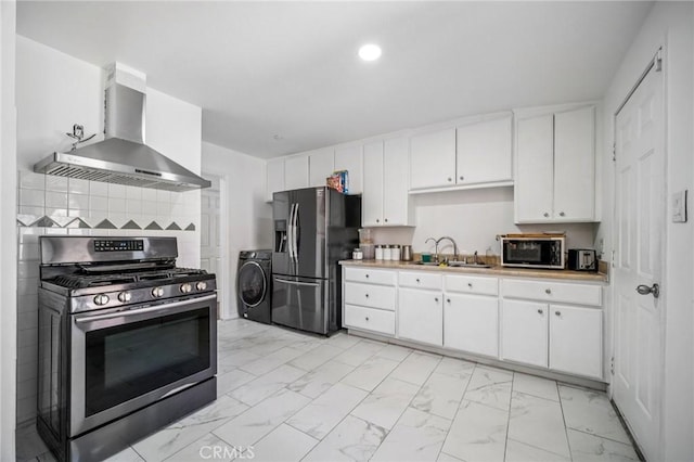 43926 3rd St E, Lancaster, CA 93535 - kitchen featuring stainless steel gas range oven, wall chimney range hood, refrigerator with ice dispenser, washer / dryer, and light marble finish flooring