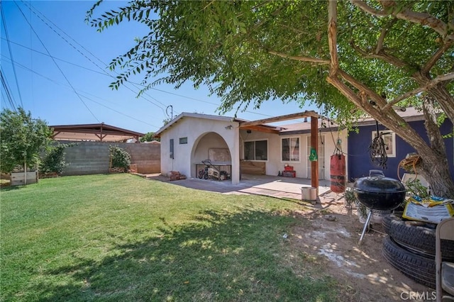43926 3rd St E, Lancaster, CA 93535 - back of property featuring stucco siding and a patio area