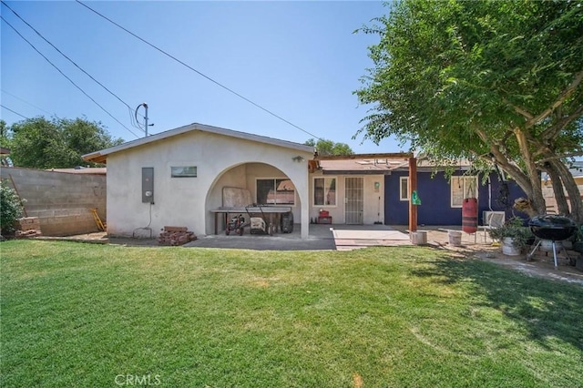 43926 3rd St E, Lancaster, CA 93535 - rear view of house featuring stucco siding and a patio area