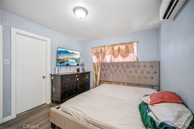 43926 3rd St E, Lancaster, CA 93535 - bedroom featuring a wall mounted air conditioner and wood finished floors