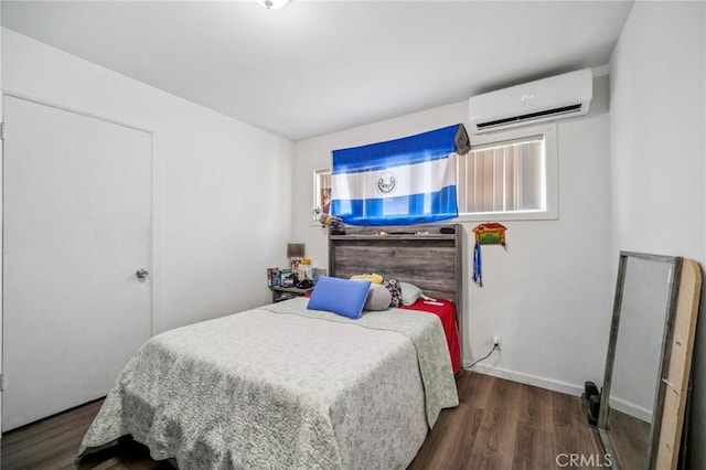 43926 3rd St E, Lancaster, CA 93535 - bedroom featuring an AC wall unit and wood finished floors