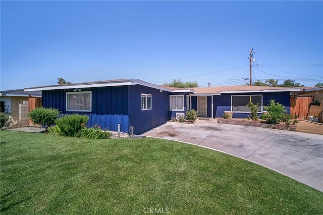 43926 3rd St E, Lancaster, CA 93535 - ranch-style house featuring a front yard and board and batten siding