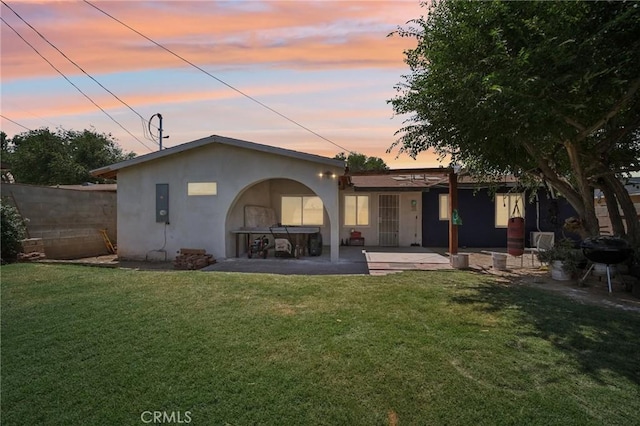 43926 3rd St E, Lancaster, CA 93535 - back of property at dusk featuring a patio and stucco siding