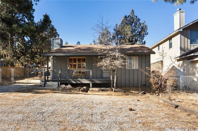 130 Maple Ln, Sugarloaf, CA 92386 - bungalow with a chimney, covered porch, and board and batten siding
