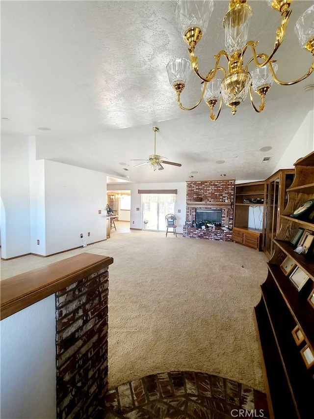 325 Canyon Rd, Pinon Hills, CA 92372 - carpeted living room with a brick fireplace, a ceiling fan, and a chandelier