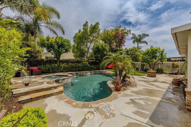 20770 Stony Brook Cir, Riverside, CA 92508 - view of swimming pool featuring a patio area, a fenced backyard, and a pool with connected hot tub