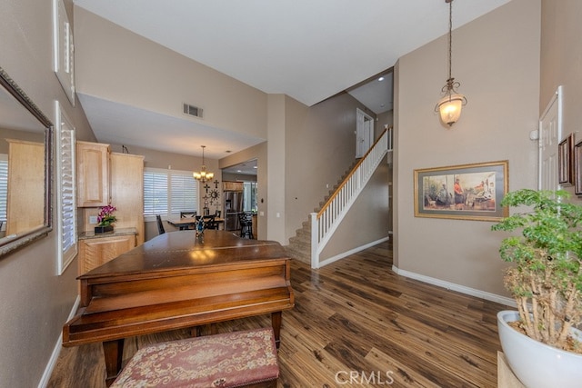 20770 Stony Brook Cir, Riverside, CA 92508 - staircase with wood finished floors, a chandelier, and a towering ceiling