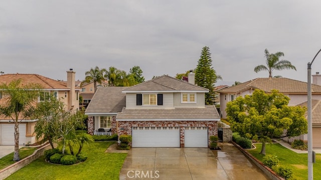 20770 Stony Brook Cir, Riverside, CA 92508 - traditional-style home featuring a garage, a front yard, concrete driveway, and a chimney