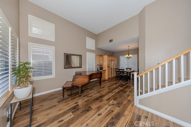 20770 Stony Brook Cir, Riverside, CA 92508 - sitting room featuring a towering ceiling, dark wood finished floors, and a chandelier