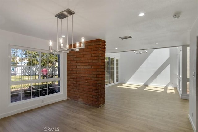 6 Mandrake Way, Irvine, CA 92612 - unfurnished dining area with a chandelier, wood finished floors, and recessed lighting