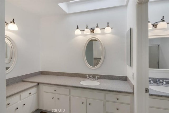 6 Mandrake Way, Irvine, CA 92612 - bathroom featuring a skylight and vanity