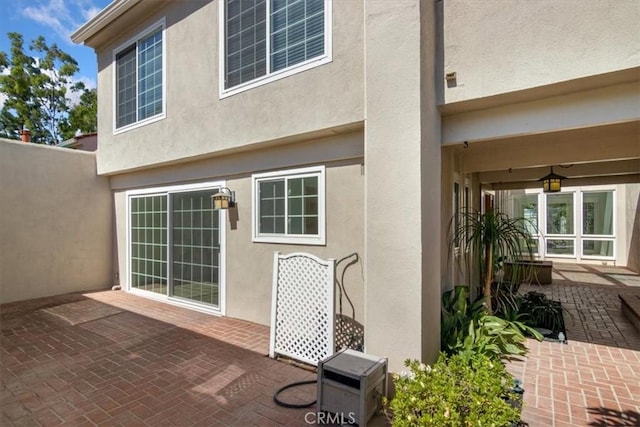 6 Mandrake Way, Irvine, CA 92612 - rear view of house with stucco siding and a patio