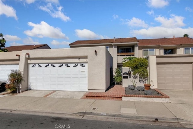 6 Mandrake Way, Irvine, CA 92612 - mediterranean / spanish house with stucco siding, driveway, a tiled roof, and a garage