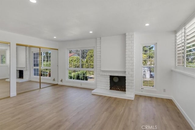6 Mandrake Way, Irvine, CA 92612 - unfurnished living room featuring a fireplace, wood finished floors, and recessed lighting