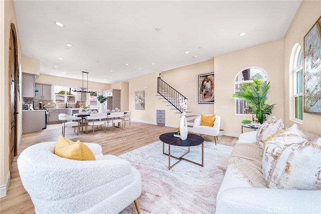 2709 Cogswell Rd Unit A, El Monte, CA 91732 - living room featuring stairs, light wood-type flooring, and recessed lighting