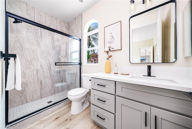 2709 Cogswell Rd Unit A, El Monte, CA 91732 - bathroom featuring vanity, a marble finish shower, and wood finished floors