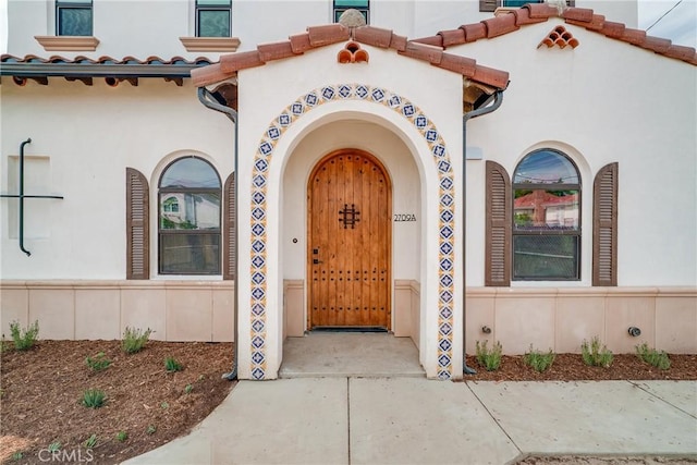 2709 Cogswell Rd Unit A, El Monte, CA 91732 - doorway to property with stucco siding and a tiled roof
