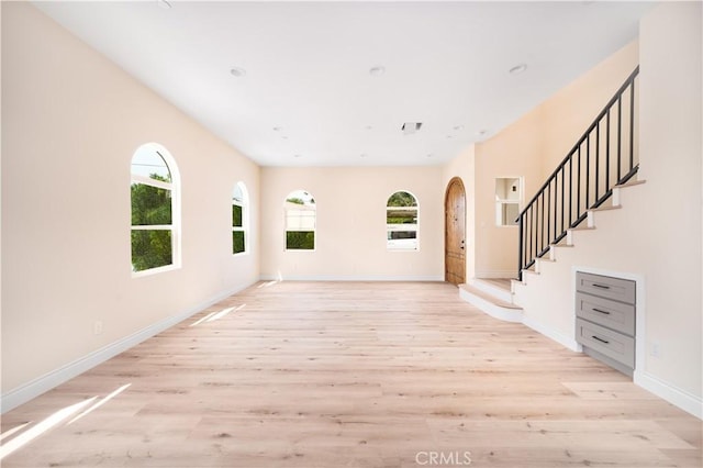 2709 Cogswell Rd Unit B, El Monte, CA 91732 - entrance foyer featuring plenty of natural light, light wood-style flooring, and arched walkways
