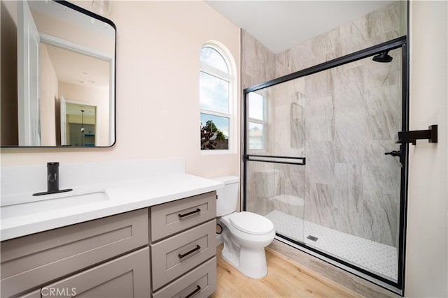 2709 Cogswell Rd Unit B, El Monte, CA 91732 - bathroom featuring a marble finish shower, vanity, and wood finished floors
