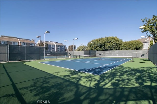20191 Cape Coral Ln Unit 3-206, Huntington Beach, CA 92646 - view of tennis court featuring community basketball court