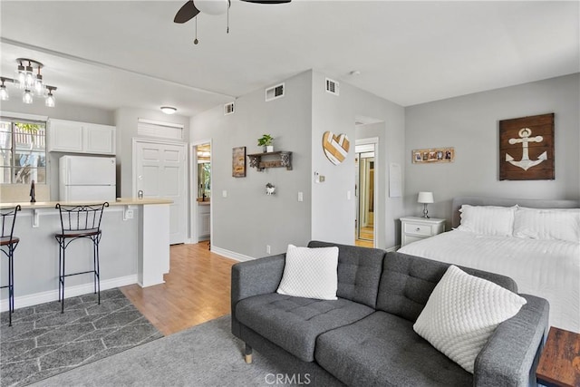 20191 Cape Coral Ln Unit 3-206, Huntington Beach, CA 92646 - living area featuring ceiling fan and wood finished floors