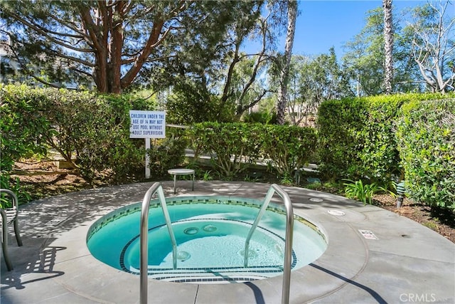 20191 Cape Coral Ln Unit 3-206, Huntington Beach, CA 92646 - view of swimming pool featuring a community hot tub