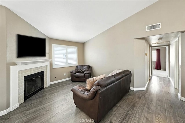 18818 Vista Del Canon Unit G, Newhall, CA 91321 - living area featuring dark wood-type flooring, plenty of natural light, a brick fireplace, and high vaulted ceiling