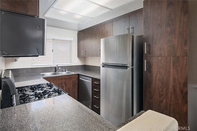18818 Vista Del Canon Unit G, Newhall, CA 91321 - kitchen featuring appliances with stainless steel finishes and dark countertops