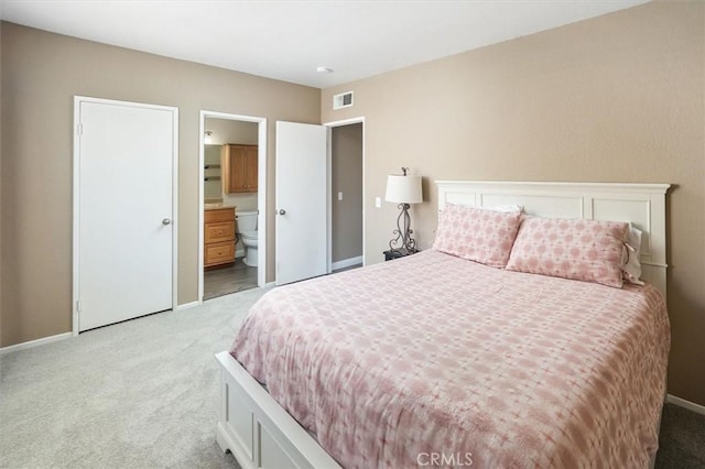 18818 Vista Del Canon Unit G, Newhall, CA 91321 - bedroom with light colored carpet and ensuite bathroom