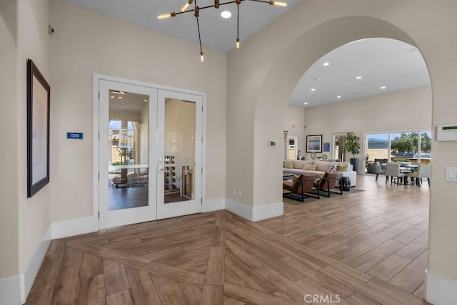 20552 Galloway, Saugus, CA 91350 - foyer featuring french doors, arched walkways, wood finished floors, and recessed lighting