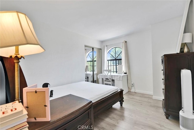 1029 S Reservoir St, Pomona, CA 91766 - bedroom with light wood-style flooring and baseboards