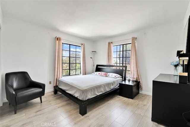 1029 S Reservoir St, Pomona, CA 91766 - bedroom featuring multiple windows and light wood finished floors