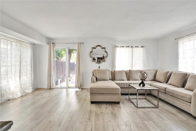1029 S Reservoir St, Pomona, CA 91766 - living area with light wood finished floors and baseboards
