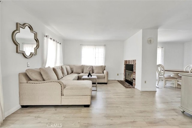 1029 S Reservoir St, Pomona, CA 91766 - living area featuring light wood-style floors and a fireplace