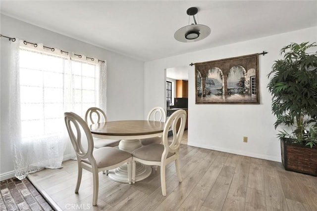1029 S Reservoir St, Pomona, CA 91766 - dining space featuring baseboards and light wood-style floors