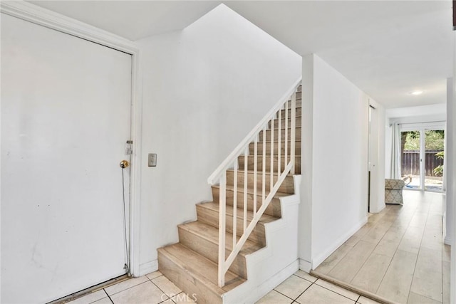 1029 S Reservoir St, Pomona, CA 91766 - stairs featuring tile patterned floors
