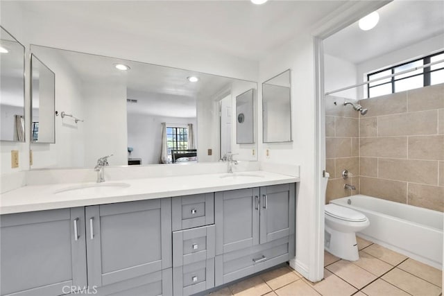 1029 S Reservoir St, Pomona, CA 91766 - full bath featuring double vanity, tile patterned floors, recessed lighting, and washtub / shower combination