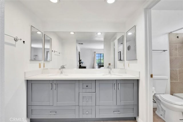 1029 S Reservoir St, Pomona, CA 91766 - bathroom with double vanity, tiled shower, and recessed lighting