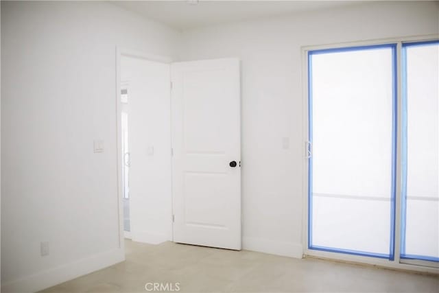 54889 Navajo Trl, Yucca Valley, CA 92284 - unfurnished bedroom featuring baseboards