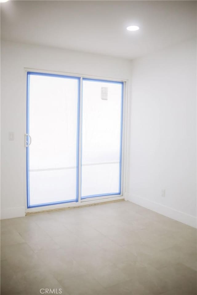 54889 Navajo Trl, Yucca Valley, CA 92284 - empty room with baseboards and recessed lighting