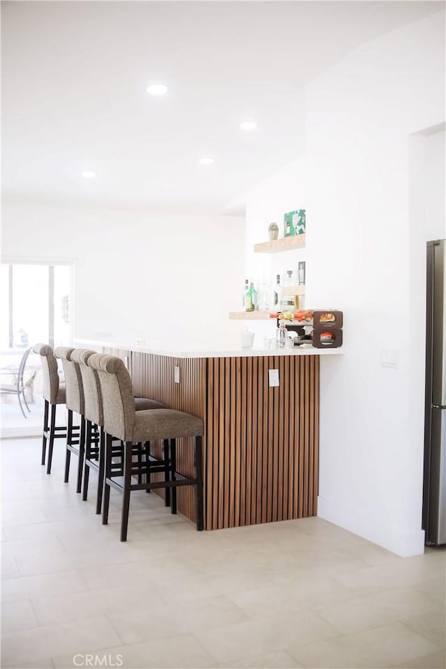 54889 Navajo Trl, Yucca Valley, CA 92284 - bar area with freestanding refrigerator and recessed lighting
